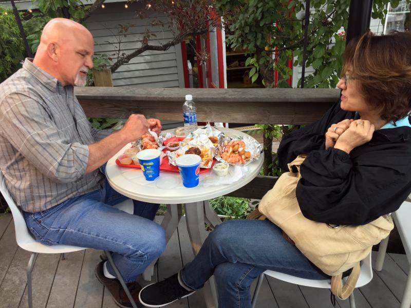 A couple enjoys lobster rolls at Red’s Eats. SUZI THAYER/Boothbay Register