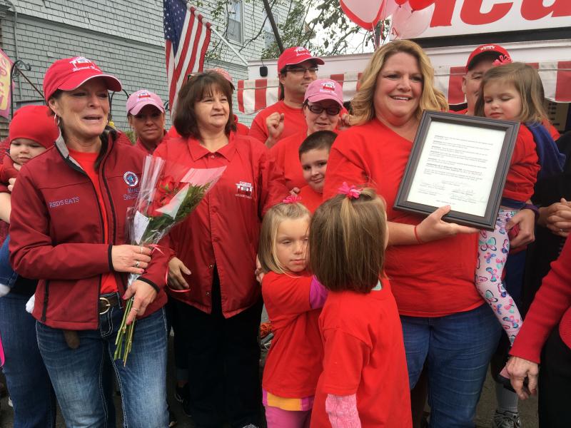 Cindy Collamore holds the proclamation that named Sept. 30 Red’s Day, from the town of Wiscasset. SUZI THAYER/Boothbay Register