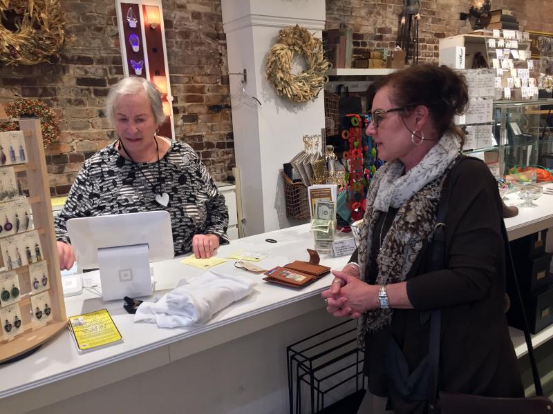 Deb Schaffer, left, waits on a customer in her Wiscasset shop, Debra Elizabeth’s. SUZI THAYER/Boothbay Register