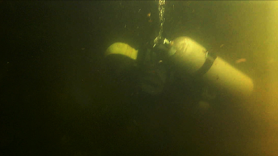 At about six feet below, Fuller checks on the vertical pipe. JOSEPH CHARPENTIER/Boothbay Register