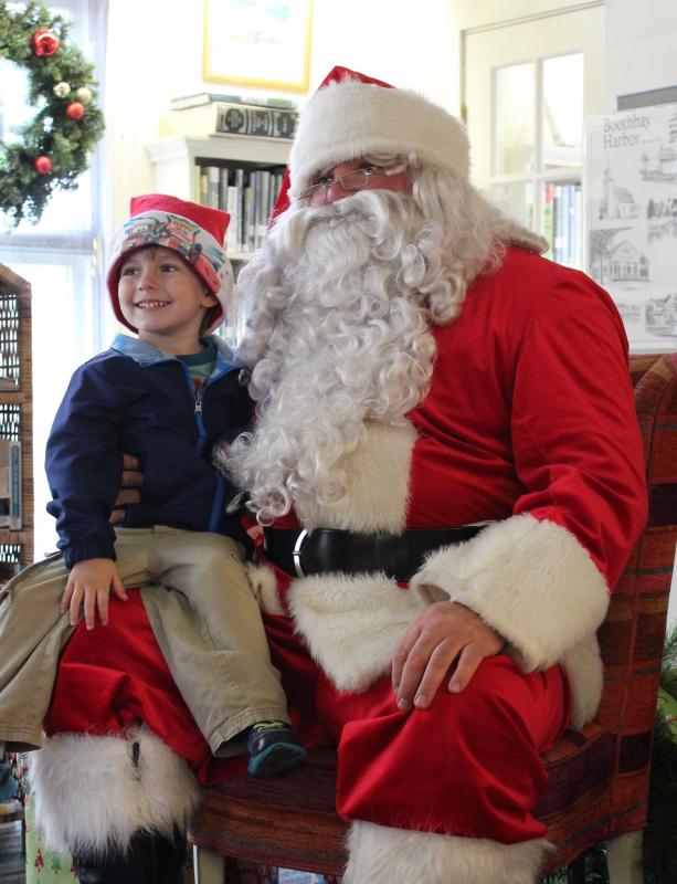 Finn Leeman was the first of hundreds of youngsters to visit with Santa at the library. Many more photos of the festival appear in the Harbor Lights 2017 gallery at www.boothbayregister.com SUE MELLO/Boothbay Register