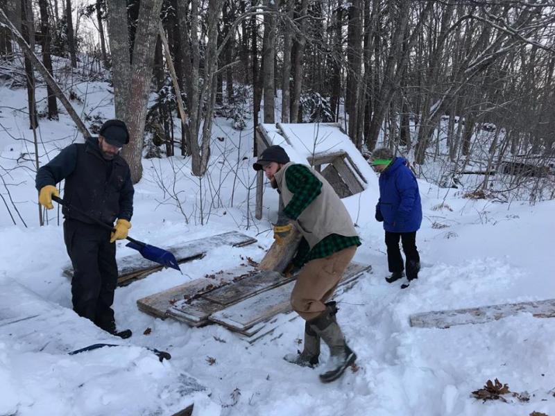 Kevin Anthony, far left, Wyatt Anthony and Jeanne Tonon help get the rink ready for the winter on Dec. 27. Courtesy of Mame Anthony