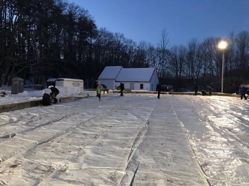 Volunteers worked into the dark hours to get the rink ready for the winter on Dec. 27. Courtesy of Mame Anthony