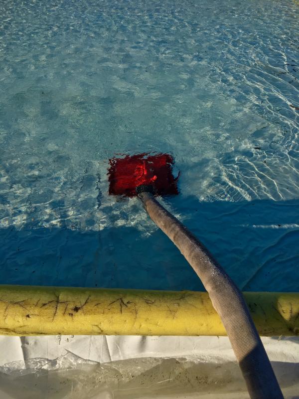 Water being pumped into the rink from the fire station on Dec. 28. SUZI THAYER/Boothbay Register