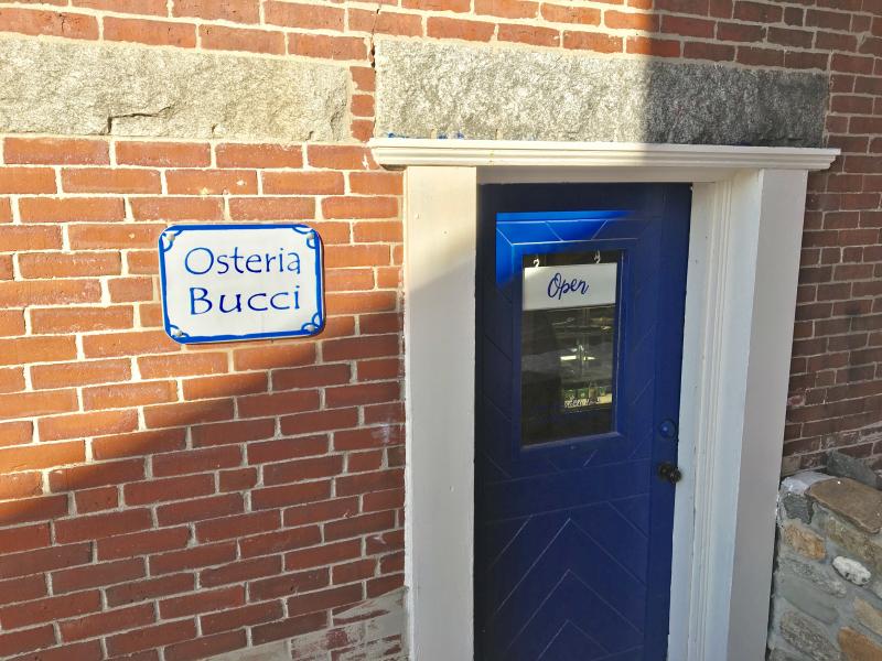 There are two signs Bernie DeLisle hangs on the door of his Damariscotta osteria. One says “Open,” the other says “Sold Out.” SUZI THAYER/Boothbay Register