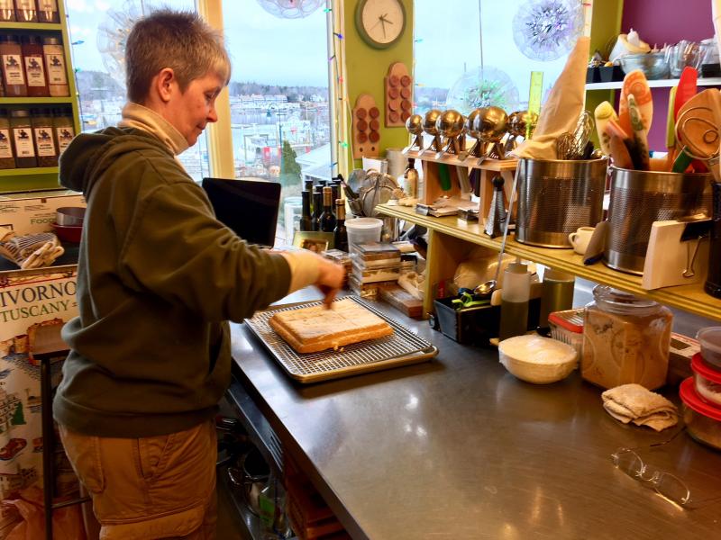 Kim Martin talks to something she’s baking in her Eventide kitchen. SUZI THAYER/Boothbay Register