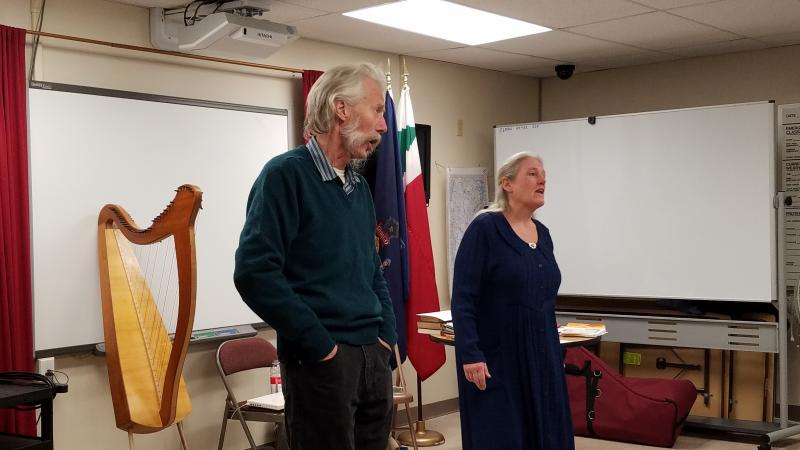 Fred Gosbee, left, and Julia Lane sing about “New England Annoyances” Feb. 11. KATRINA RICKERMANN/Wiscasset Newspaper