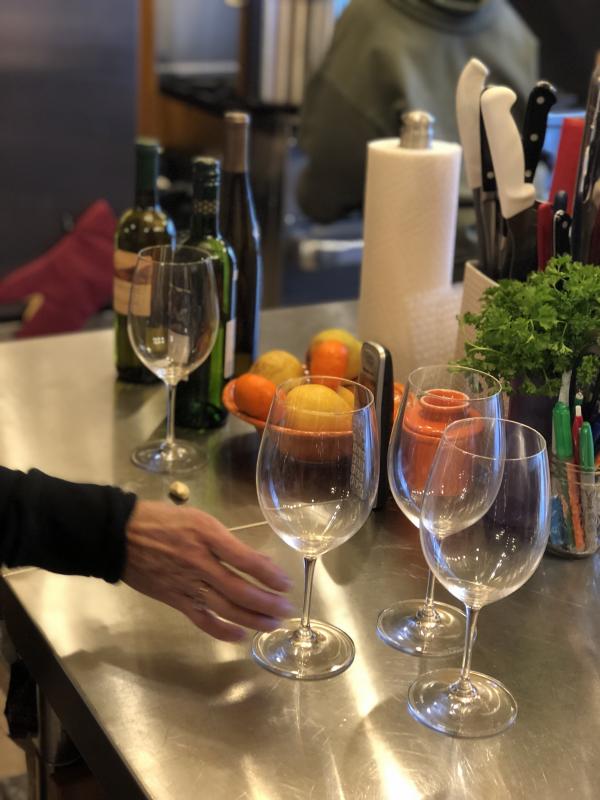 It’s not uncommon to see glasses ready and waiting for wine tastings in Eventide’s kitchen. Courtesy of Michael Maxim