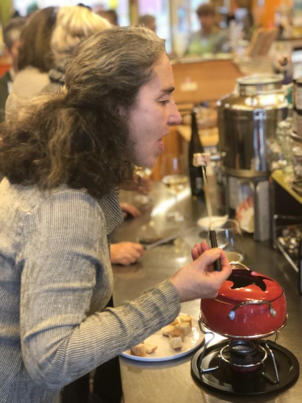 Sue Mello tests the fondue. It was a winner. SUZI THAYER/Boothbay Register