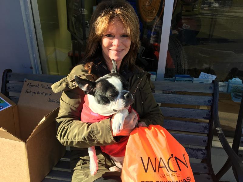 Debbie Gagnon and her rescue pup, Daisy Duke, with a pet oxygen mask kit for the Edgecomb Fire Department. SUZI THAYER/ Boothbay Register