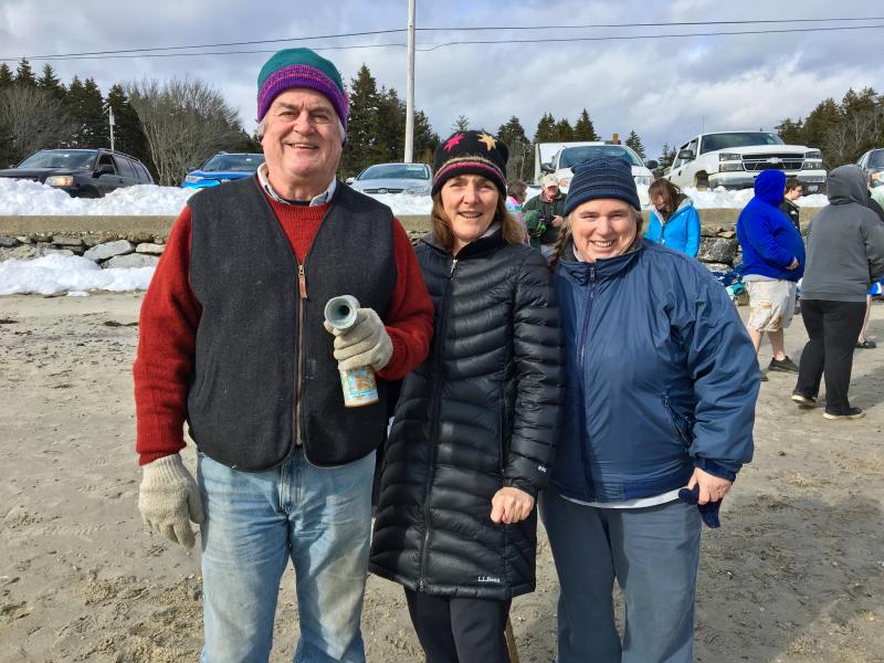 Event organizers Tom Witt, left, Sue Witt and Toby LeConte at the Leprechaun Leap at Hendricks Head Beach on Southport Island. SUZI THAYER/Boothbay Register