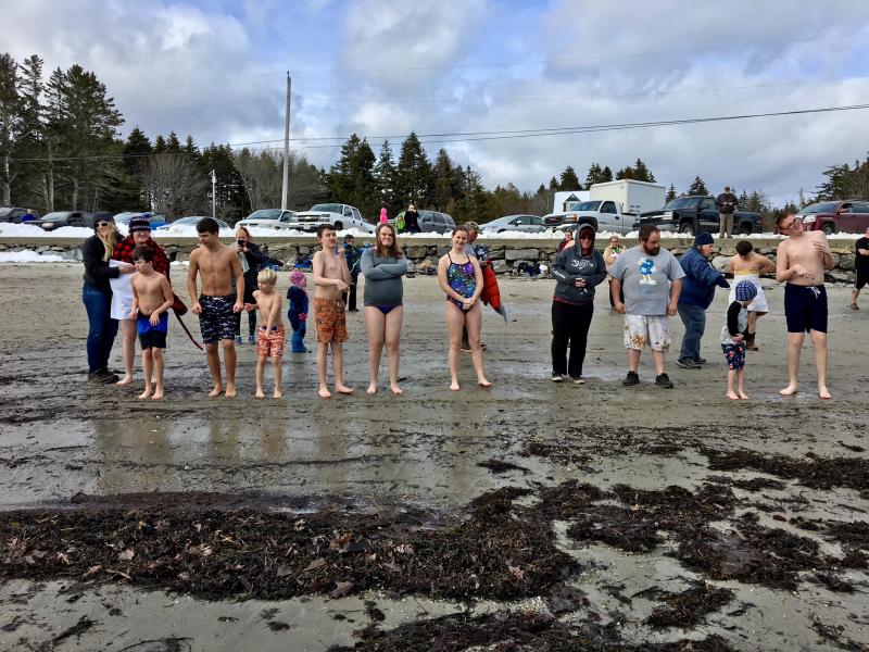 Leprechaun Leapers ready to make the plunge at Hendricks Head Beach on Southport Island. SUZI THAYER/Boothbay Register
