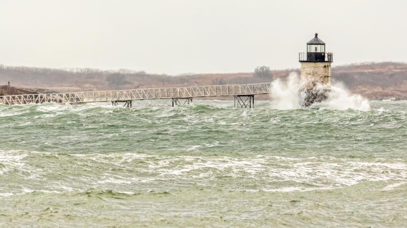 Ram Island Light gets hit by ocean waves. Courtesy of Mike Leonard