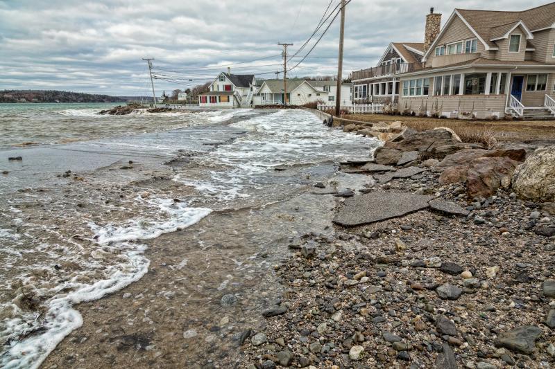 Waves wash up into the road near Ocean Point Inn. Courtesy of Mike Leonard