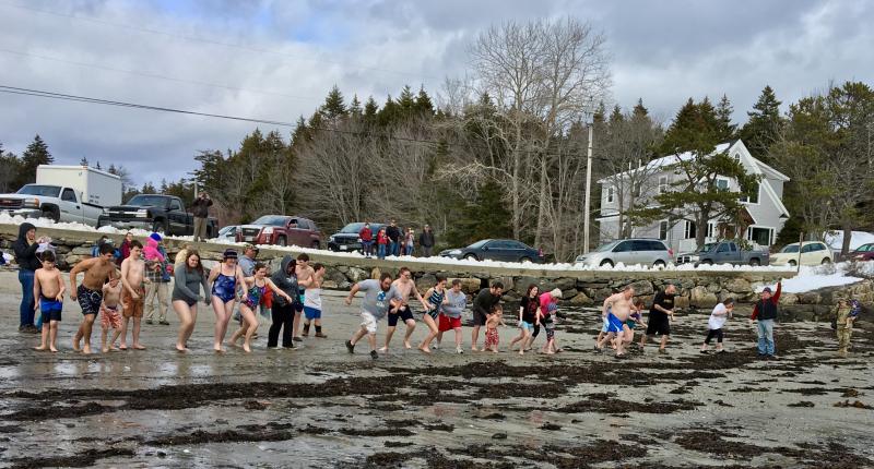 Participants line up to await the air horn blast at the Leprechaun Leap at Hendricks Head Beach on Southport Island March 15. SUZI THAYER/Boothbay Register