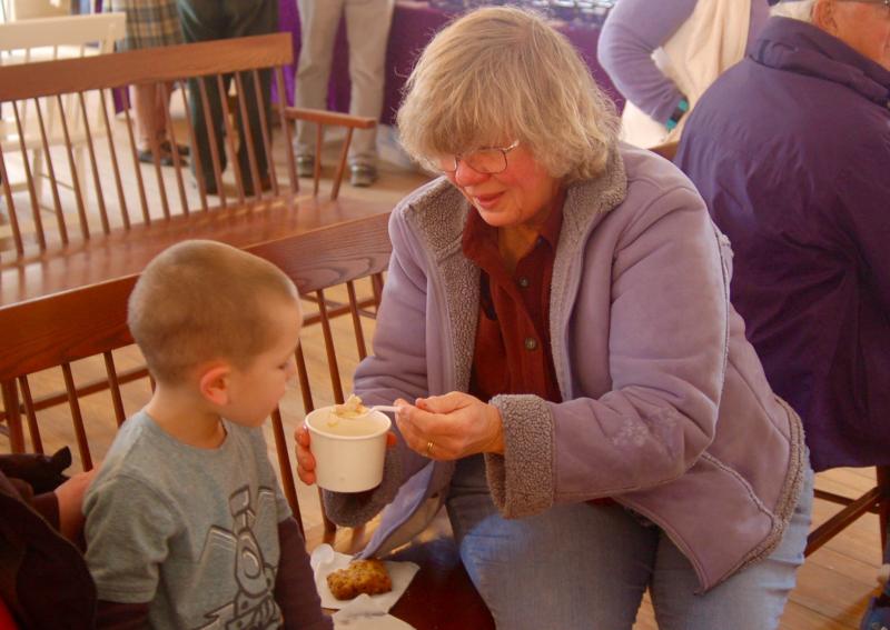 Debbie Williams shares cock-a-leekie soup with grandson Connor. ART MAYERS/Boothbay Register