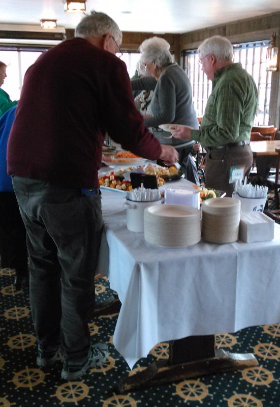 Guests enjoy the many hors d’oeuvres offered at the Health Center’s fundraiser. JANE CARPENTER/Boothbay Register
