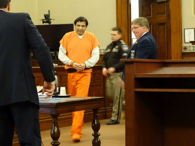 Julio Carrillo is led into the courtroom. (photo by Erica Thoms)