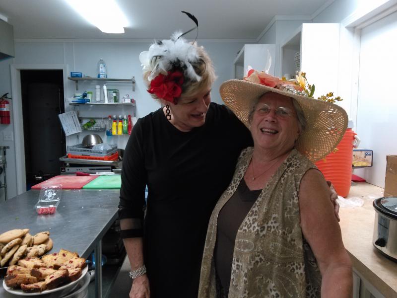 Center Director Jane Good, left, and the Rotary’s Debbie Graves share a laugh in the Rotary clubhouse kitchen during the 2018 Kentucky Derby party. JANE CARPENTER/Boothbay Register