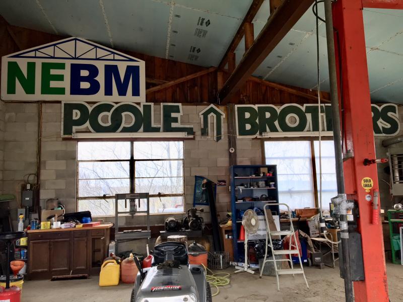 Vintage signs from Boothbay Harbor adorn the walls of Hyson’s shop. SUZI THAYER/Boothbay Register