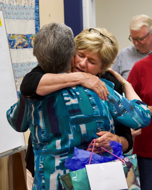 A tearful Jane Good thanks Betty Sullivan for her gift. Courtesy of Bob Crink