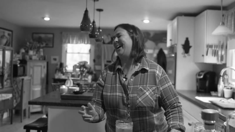 In the commercial, Lisa Hallinan looks at someone off-camera who is tasting one of her cocktails, and Hallinan says, “Isn’t it good!” Courtesy of Maine Spirits