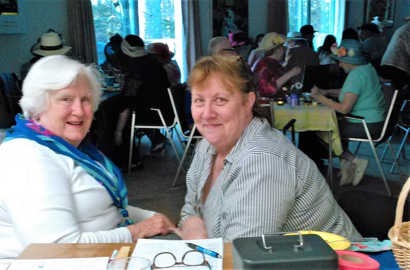 Community Center board members Margaret Jones Perritt, left, and Lucy Cressey enjoy the 2018 Kentucky Derby at the Boothbay Harbor Rotary clubhouse. JANE CARPENTER/Boothbay Register