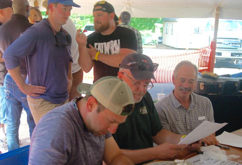 Judges confer as finalists look on. ART MAYERS/Boothbay Register
