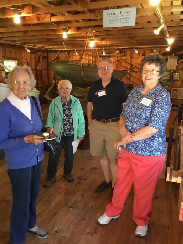 Vistors and volunteers Jim and Becky Singer, left, enjoy refreshments in the boathouse. ISABELLE CURTIS/Boothbay Register