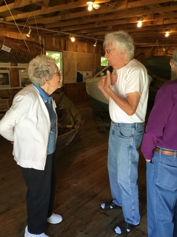 Board of Trustees member Evelyn Sherman, left, holds a conversation in the boathouse. ISABELLE CURTIS/Boothbay Register