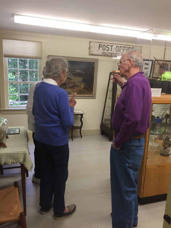 Ron Orchard, right, one of the museum's original members, expands on the history of its founding. ISABELLE CURTIS/Boothbay Register