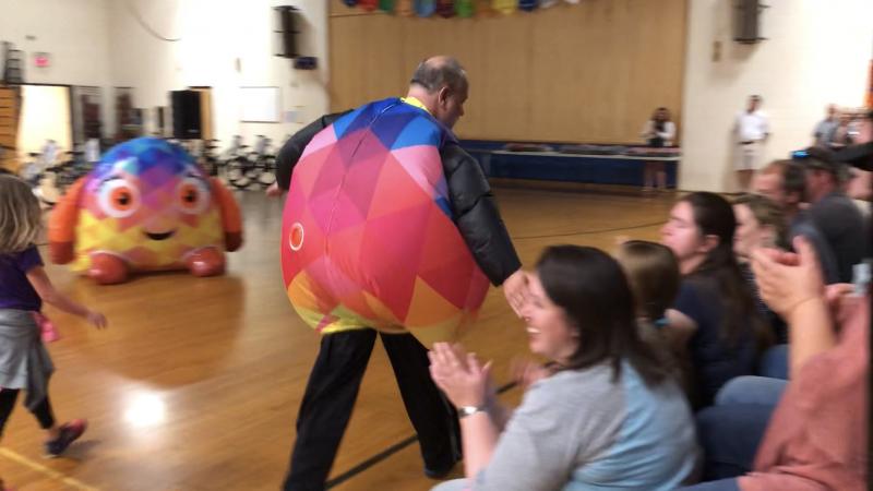 Principal Mark Tess, dressed in a Disco inflatable costume, greets the audience during the assembly. PAGE BROWN/Boothbay Register
