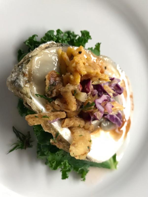 Jenny Moore’s “South in Your Mouth”: Cafe DuMond smoked pimento cheese, Florida citrus slaw, Jack Daniels BBQ mignonette, fried sweet onions and fresh dill. Courtesy photo