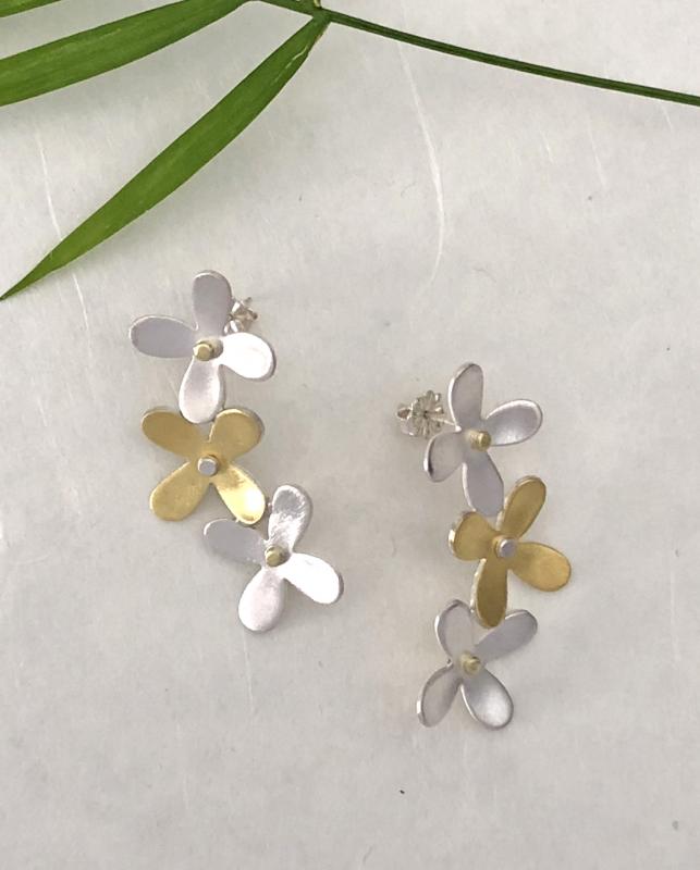 Silver and gold hydrangea floral stud earrings by Christine Peters. Courtesy of Christine Peters Christine Peters