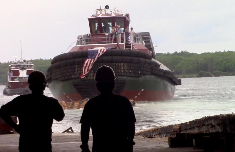 Workers watch as the Judy Moran slips into the water. ART MAYERS/Boothbay Register