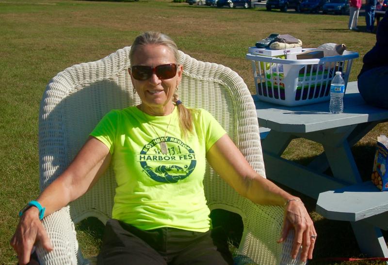 Lolly Donatelli tries a rock on a wicker chair .ART MAYERS/Boothbay Register