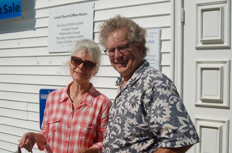 Lynne and John Seitzer take home white elephant items. ART MAYERS/Boothbay Register