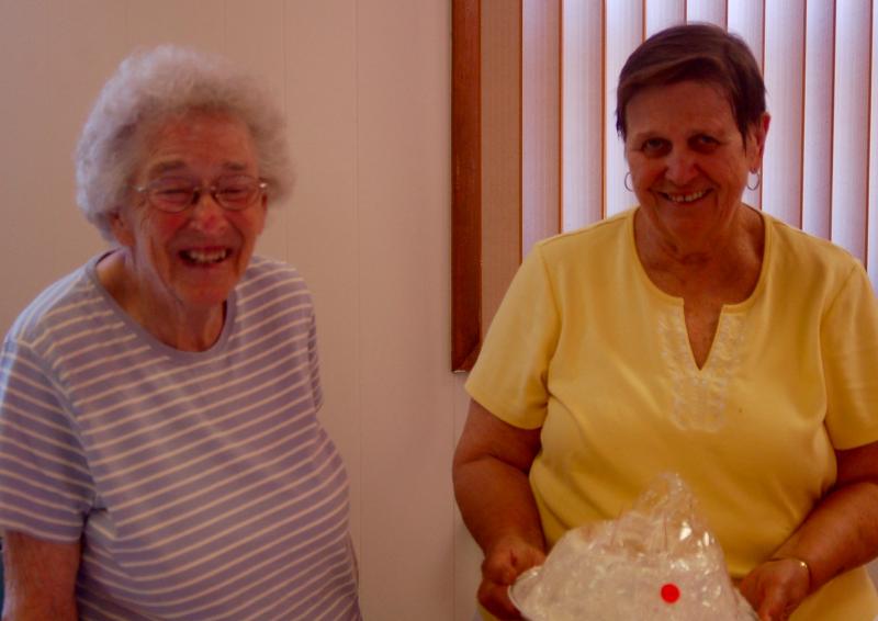 Jean Thompson and Mary Pierce at the bake sale. ART MAYERS/Boothbay Register