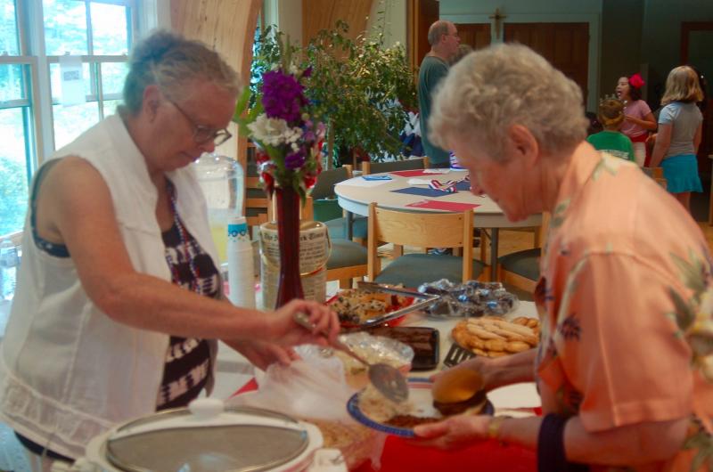 Jackie Pinard serves lunch to Miriam Wade. ART MAYERS/Boothbay Register