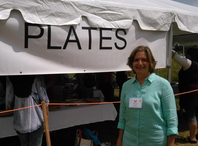 Watershed Center’s Executive Director Fran Rudoff stands by at the plate tent. JANE CARPENTER/Wiscasset Newspaper