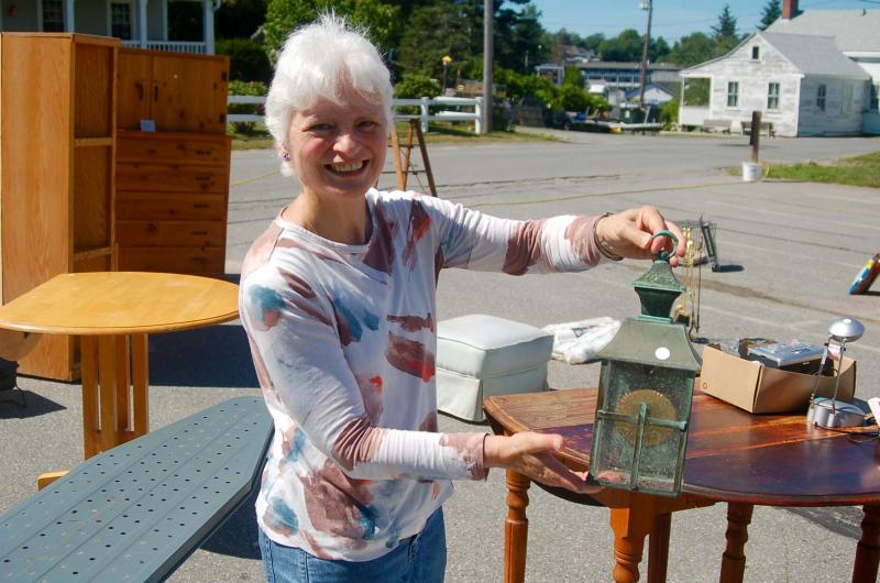 Lori Bouley, pictured, said yard sale items sold well on Saturday at the annual Our Lady, Queen of Peace Summer Fair. ART MAYERS/Boothbay Register