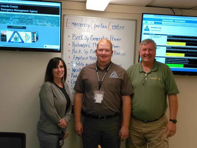 From left, Deputy Director of Lincoln County EMA Melissa Temple, Director Casey Stevens and Training and Operations Specialist Ken Desmond open the new emergency operations center July 19. JANE CARPENTER/Boothbay Register