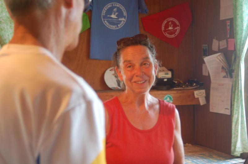 Pam Brackett greets runners at Chewonki Campground. ART MAYERS/Wiscasset Newpaper