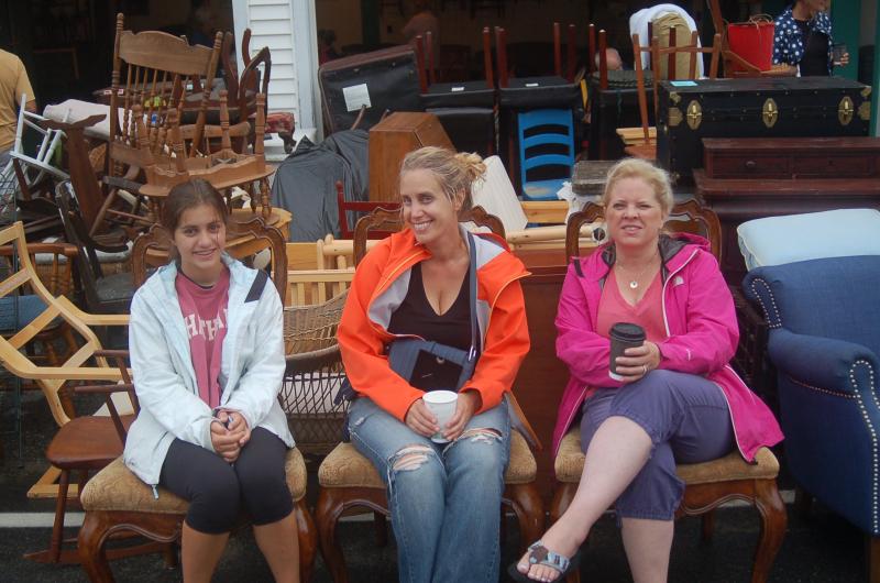 Ava and Stacey Gauthier and Lianna Kingsbury try out some fancy chairs. ART MAYERS/Boothbay Register