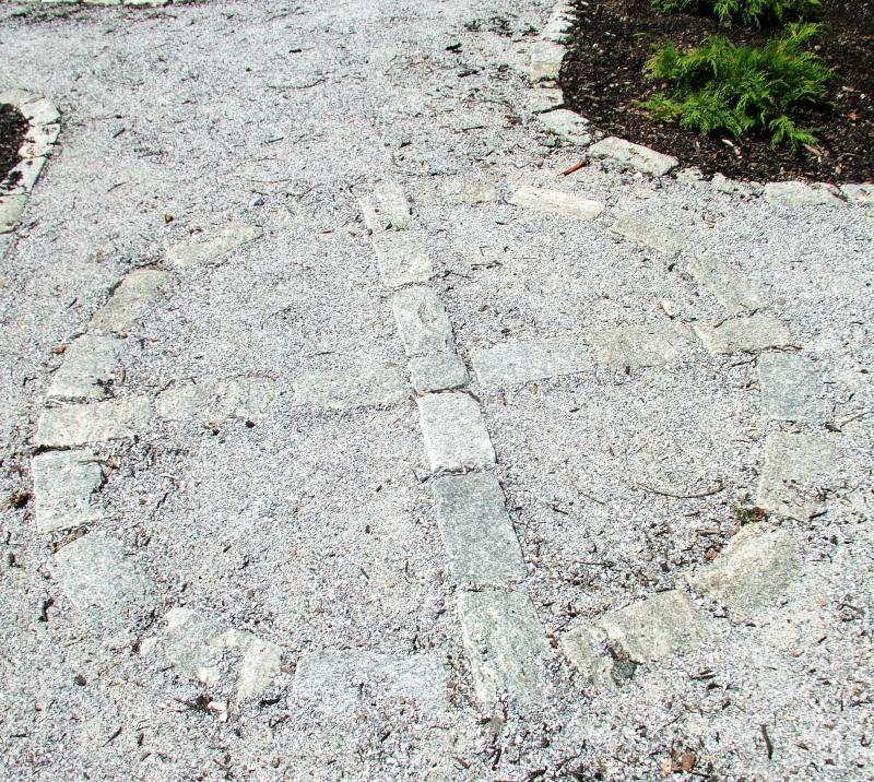 This cobblestone design marks the point where the paths intersect in the Meditation Garden, LISA KRISTOFF/Boothbay Register