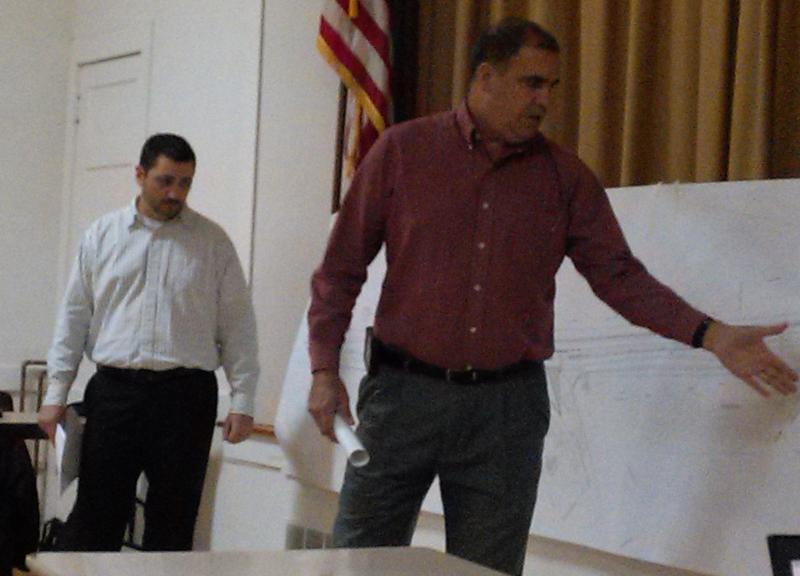 MDOT engineer Matt Philbrick, left, and senior project manager Ernie Martin point out sections of the Routes 1 and 27 project map at the Oct. 22 public hearing. JANE CARPENTER/Boothbay Register