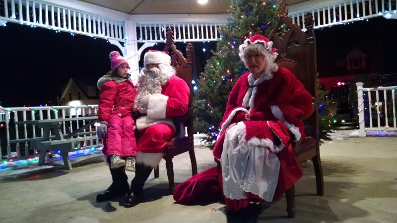 Kate Hallinan of Boothbay is one of the first to meet Santa and Mrs. Claus. MARGARET HOFFMAN/Boothbay Register