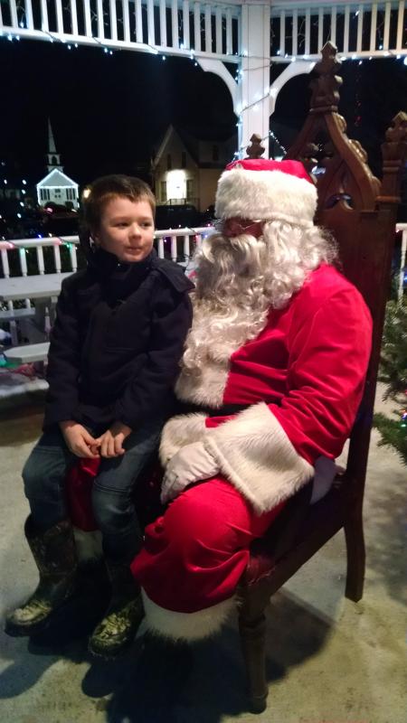 Carson Cook asked Santa to bring him a Transformer. The request sparked a debate with Santa about whose favorite character was best. MARGARET HOFFMAN/Boothbay Register