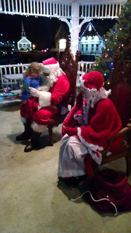 Violet Baldwin of Boothbay brought a handwritten note for Santa. She got a little shy when he wanted her to also tell him what she wanted for Christmas this year. MARGARET HOFFMAN/Boothbay Register