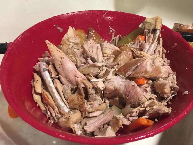 Once your simmered ingredients have cooled, pick away to get the meat and vegetables ready for the soup. Lisa Orne Hallinan photo